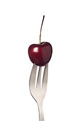 Image showing Cherry held by a fork