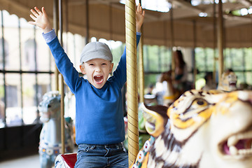 Image showing boy at carousel