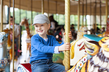 Image showing boy at carousel