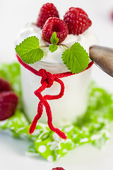 Image showing Raspberries and yoghurt or clotted cream