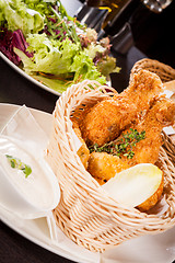 Image showing Crisp crunchy golden chicken legs and wings