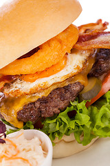 Image showing Delicious egg and bacon cheeseburger