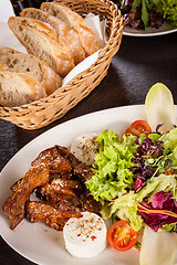 Image showing grilled beef stripes fresh salad and goat cheese