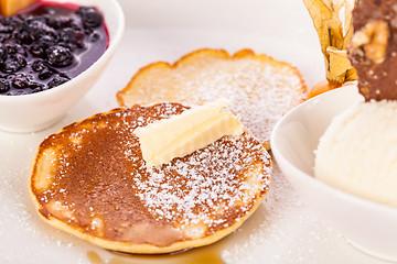 Image showing tasty sweet pancakes with vanilla icecream and topping