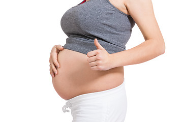 Image showing Pregnant woman giving a thumbs up gesture