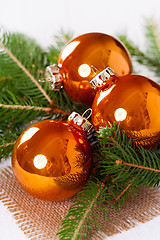 Image showing Shiny bright copper colored Christmas balls