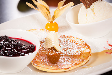 Image showing tasty sweet pancakes with vanilla icecream and topping