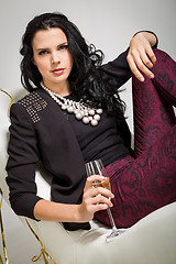 Image showing Seductive brunette holding a glass of champagne