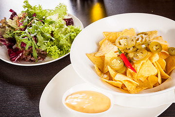 Image showing Nachos with cheese sauce and chilli pepperoni