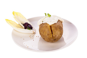 Image showing Baked jacket potato with sour cream sauce