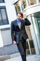 Image showing Businessman standing waiting for someone