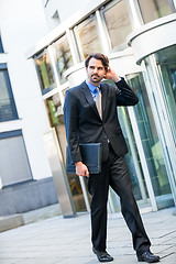 Image showing Businessman standing waiting for someone