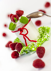 Image showing Raspberries and yoghurt or clotted cream