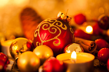 Image showing Warm gold and red Christmas candlelight background