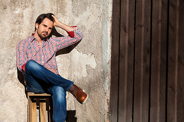 Image showing Male model sitting with legs crossed