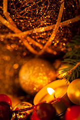 Image showing Warm gold and red Christmas candlelight background