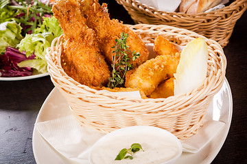 Image showing Crisp crunchy golden chicken legs and wings