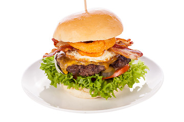 Image showing Delicious egg and bacon cheeseburger