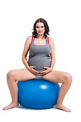 Image showing Pregnant woman doing pilates exercises