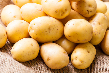 Image showing Farm fresh  potatoes on a hessian sack