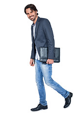 Image showing Handsome stylish man carrying a briefcase