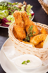 Image showing Crisp crunchy golden chicken legs and wings