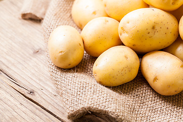 Image showing Farm fresh  potatoes on a hessian sack