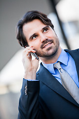 Image showing Businessman listening to a call on his mobile