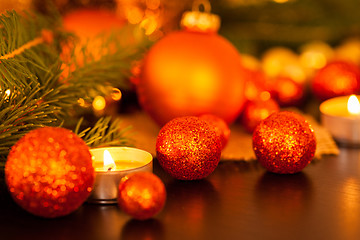 Image showing Warm gold and red Christmas candlelight background