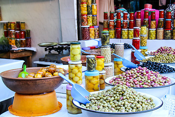 Image showing Olives and pickles on display at a farmers market