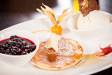 Image showing tasty sweet pancakes with vanilla icecream and topping