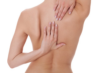 Image showing Woman caressing her bare shoulder and back