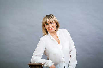 Image showing Smiling confident middle-aged blond woman