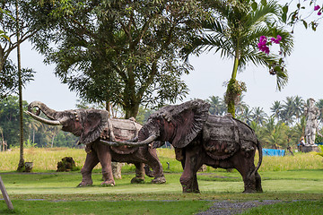 Image showing Elephant statue standing on a lawn at a park