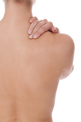 Image showing Woman caressing her bare shoulder and back