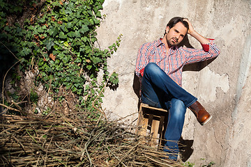 Image showing Male model sitting with legs crossed