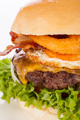 Image showing Delicious egg and bacon cheeseburger