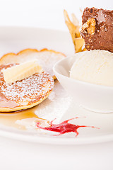 Image showing tasty sweet pancakes with vanilla icecream and topping