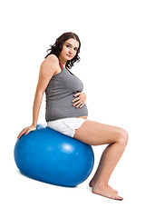 Image showing Pregnant woman doing pilates exercises