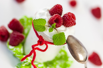 Image showing Raspberries and yoghurt or clotted cream