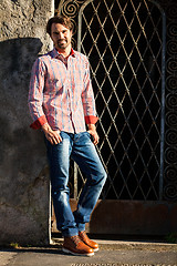 Image showing Male model leaning against wall