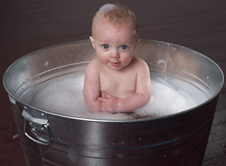 Image showing Confident Infant in Bubble Bath Looking Straight at the Camera