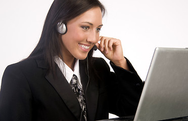 Image showing Customer Service Woman Works on Computer While Talking With Head