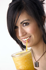 Image showing Girl with Yellow Food Fruit Smoothie