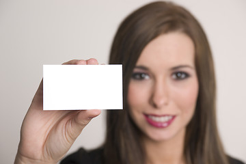Image showing Attractive Female Holds Blank Business Card Horizontal Compositi