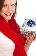 Image showing the gift offered by beautiful brunette in red scarf