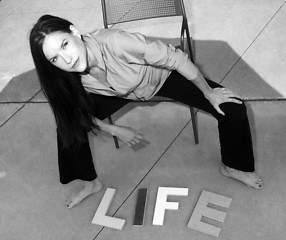Image showing Attractive woman on concrete Above the Word Life in Block Letter