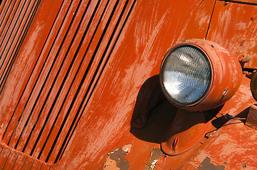 Image showing Old Orange Vinatge Fire Truck Sits Rusting in Desert Country