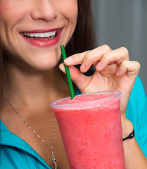 Image showing Happy Girl with Red Watermelon Smoothie