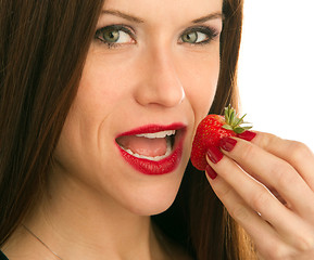 Image showing Woman eats RAW fruit Food Strawberry